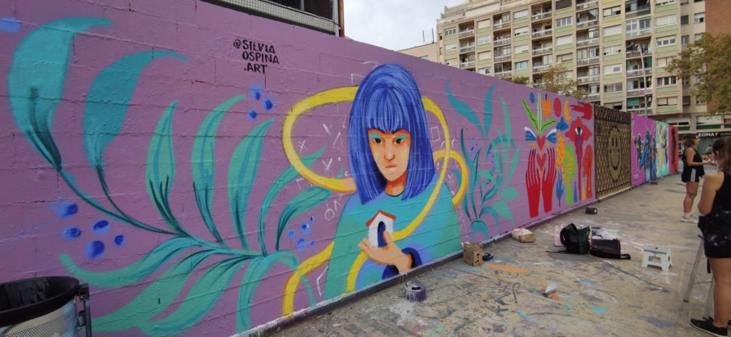 Proceso de pintura durante la actividad – JAM MIGRACIÓN WALLSPOT, Barcelona, intervención urbana, Rebobinart 2022
