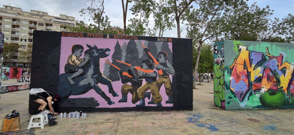 Proceso de pintura durante la actividad – JAM MIGRACIÓN WALLSPOT, Barcelona, mural exterior, Rebobinart 2022