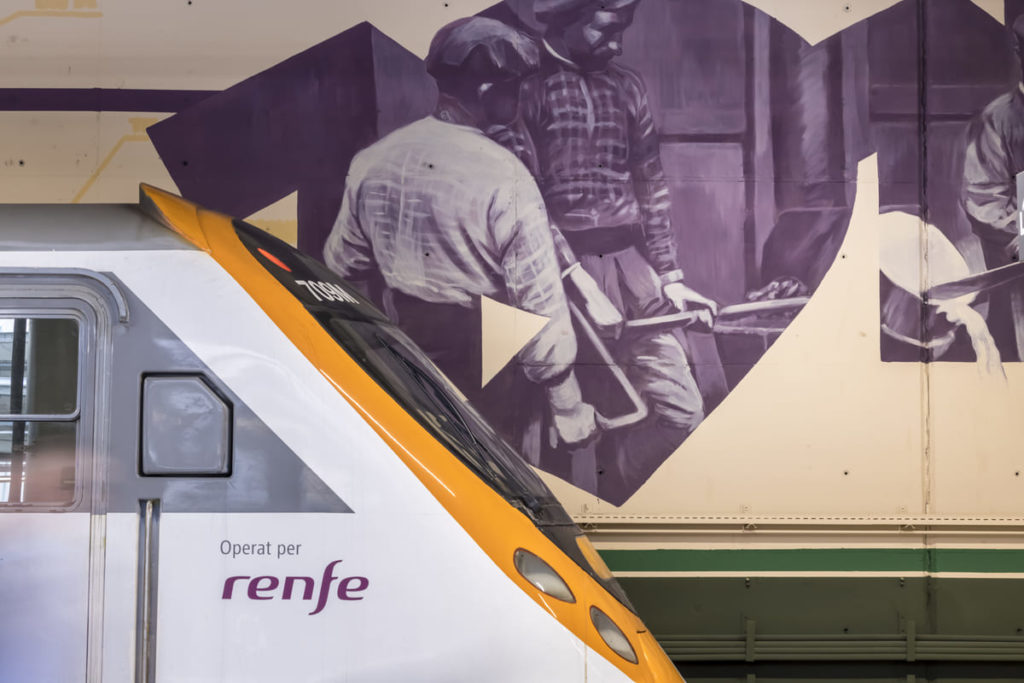Photograph of the mural by Roc Blackblock, Miquel Wert – New Sant Andreu railway station by Roc Blackblock and Miquel Wert, Estació de Sant Andreu, Barcelona, company mural, Rebobinart 2022